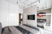 Łóżko lub łóżka w pokoju w obiekcie Exclusive Trendy Apartments