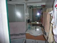 a small bathroom with a sink and a shower at Mont Blanc Soleil E17 in Manigod
