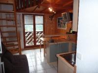 a kitchen with a sink and a counter top at Mont Blanc Soleil E17 in Manigod