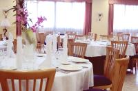A restaurant or other place to eat at Hospedium Hotel Don Fidel