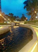 a small river in a city at night at Haogong Hotel in Taichung