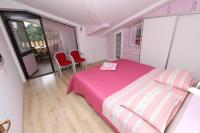 Postel nebo postele na pokoji v ubytování Apartments Daria