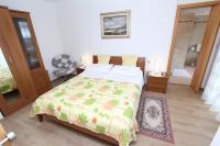 Postel nebo postele na pokoji v ubytování Apartments Daria