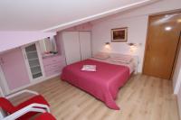 Postel nebo postele na pokoji v ubytování Apartments Daria