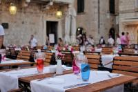 a dining room with tables with wine glasses on them at The Pucic Palace in Dubrovnik