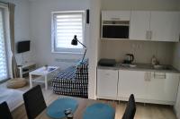 Kuchyň nebo kuchyňský kout v ubytování Slope Apartments Lipno