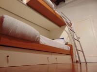 Posteľ alebo postele v izbe v ubytovaní Dante's Rooms