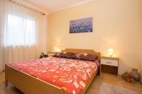 Postel nebo postele na pokoji v ubytování Apartments Kraljic