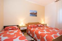Postel nebo postele na pokoji v ubytování Apartments Kraljic