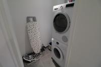 a washing machine and a dryer in a room at 2, 3 and 4 bedroom sea view Forville Apartments 5 mins from the Palais in Cannes