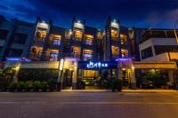 a building with blue lights in front of it at Qing Jing Ze Bed &amp; Breakfast in Hualien City