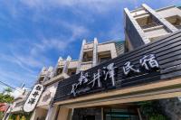 a building with writing on the side of it at Qing Jing Ze Bed &amp; Breakfast in Hualien City