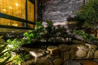 a garden in front of a building with plants at Qing Jing Ze Bed &amp; Breakfast in Hualien City