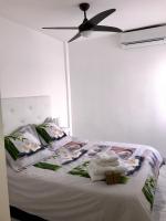 Postel nebo postele na pokoji v ubytování Appartement avec Solarium