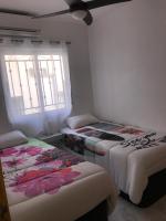 Postel nebo postele na pokoji v ubytování Appartement avec Solarium