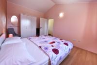 Postel nebo postele na pokoji v ubytování Villa Kmacici 376