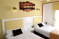 Posteľ alebo postele v izbe v ubytovaní Hotel Alda Santa Cristina