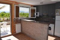 A kitchen or kitchenette at Apartamentos Matraca