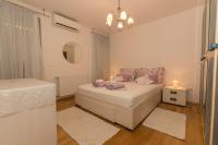 Posteľ alebo postele v izbe v ubytovaní City Central Apartments Silva