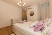Posteľ alebo postele v izbe v ubytovaní City Central Apartments Silva