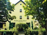 un edificio con un cartel que lee gstaad germanium en Hotel-Landgasthof Grüner Baum - Dittigheim, en Tauberbischofsheim