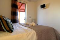 A bed or beds in a room at Suite Delicia Apartment - Appartamento con Terrazza