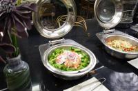 a table with two bowls of food on it at The Cloud Hotel in Kaohsiung