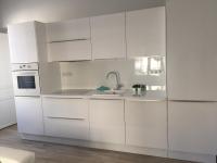 a white kitchen with a sink and a refrigerator at Relais Vacances à la Mer in Berck-sur-Mer