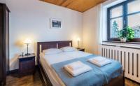 Posteľ alebo postele v izbe v ubytovaní Apartamenty Zdrojowa