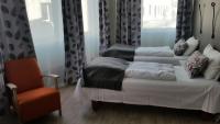 Postel nebo postele na pokoji v ubytování Corner Hotell