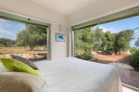 Postel nebo postele na pokoji v ubytování Villa Carlita by Perle di Puglia