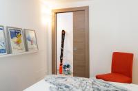 A bed or beds in a room at HelloChalet - Maison Rue de la Neige - Family Ski Holiday walking distance skirun and gondola