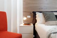 A bed or beds in a room at HelloChalet - Maison Rue de la Neige - Family Ski Holiday walking distance skirun and gondola