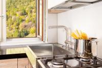 A kitchen or kitchenette at HelloChalet - Maison Rue de la Neige - Family Ski Holiday walking distance skirun and gondola