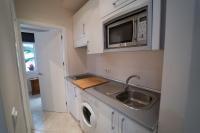 A kitchen or kitchenette at Larra Nervión Subway Tranvía