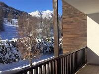 a balcony with a view of a snow covered mountain at Serre Chevalier -Cosy Apartment &quot;Le Coolidge&quot; for 7 down the slopes with stunning view in Saint-Chaffrey