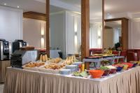 a table with a buffet of food on it at Belere Urban Hotel Rabat in Rabat