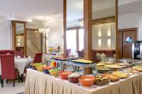a table with many different types of food on it at Belere Urban Hotel Rabat in Rabat