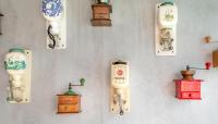 a wall with many different types of old clocks at Hotel Espresso in Amsterdam