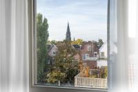 a window with a view of a church at Hotel Espresso in Amsterdam