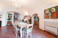 a dining room with a table and chairs at Casa Claudius - Positano in Positano