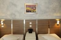 Postel nebo postele na pokoji v ubytování Socrates Hotel