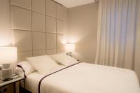 A bed or beds in a room at U-Sense Madrid Santa Ana