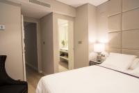 A bed or beds in a room at U-Sense Madrid Santa Ana
