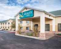 a quality inn sign on the front of a building at Quality Inn Airport in Colorado Springs
