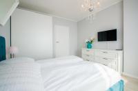 Posteľ alebo postele v izbe v ubytovaní Grand Apartments - Apartment on the 17th floor with panorama of the Old Town