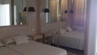 A bed or beds in a room at Azahara Beach 413