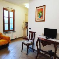 Televízia a/alebo spoločenská miestnosť v ubytovaní La casa di Gina