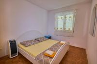Postel nebo postele na pokoji v ubytování Apartments Milina