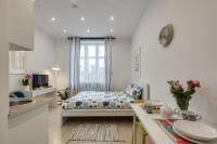 Posteľ alebo postele v izbe v ubytovaní KATO Apartamenty Centrum